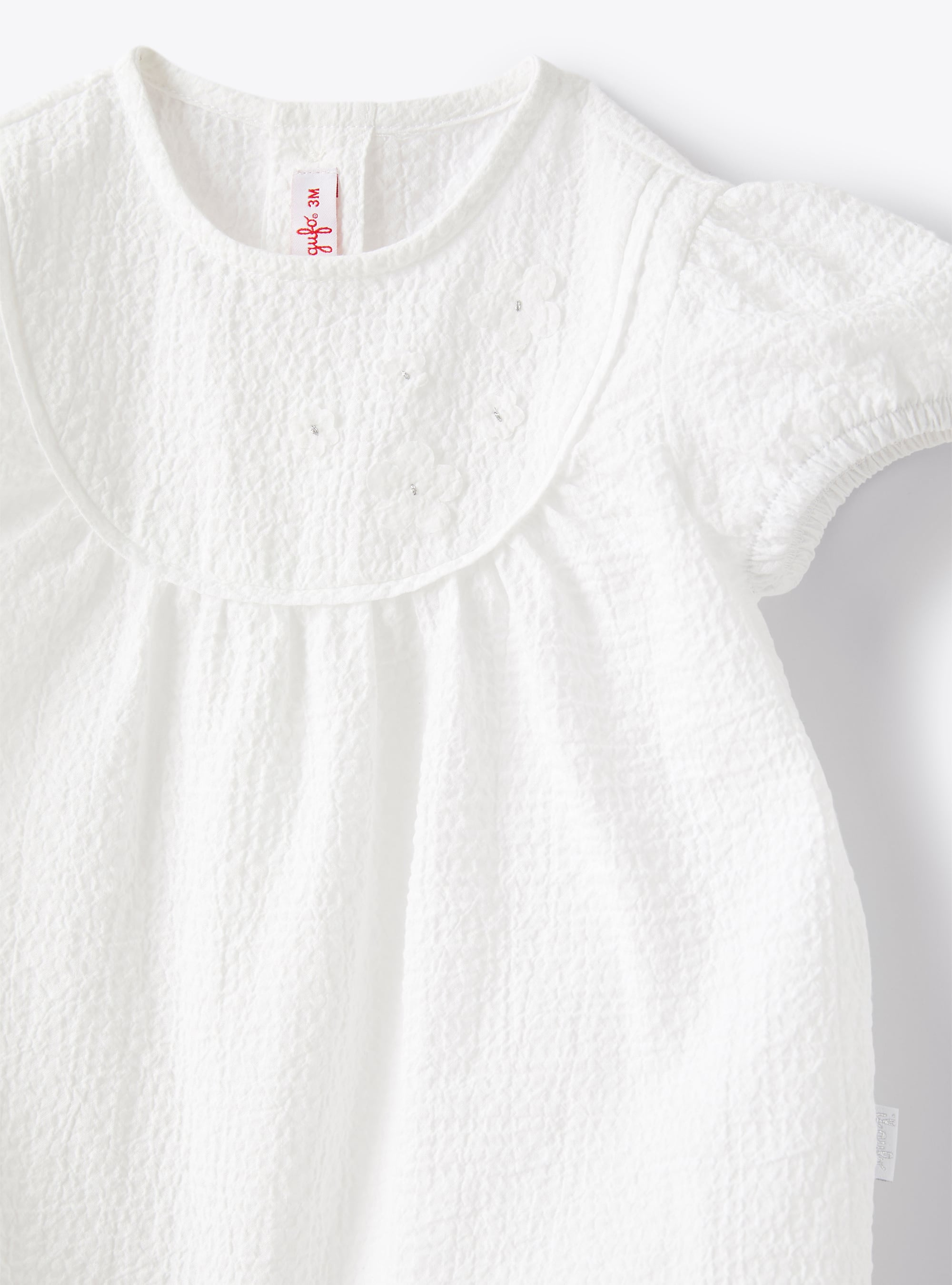 Romper suit in textured cotton - White | Il Gufo
