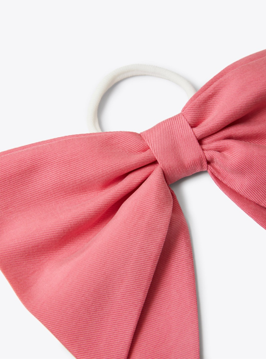 Elastic band with bow embellishment in fuchsia-pink cupro - Fuchsia | Il Gufo